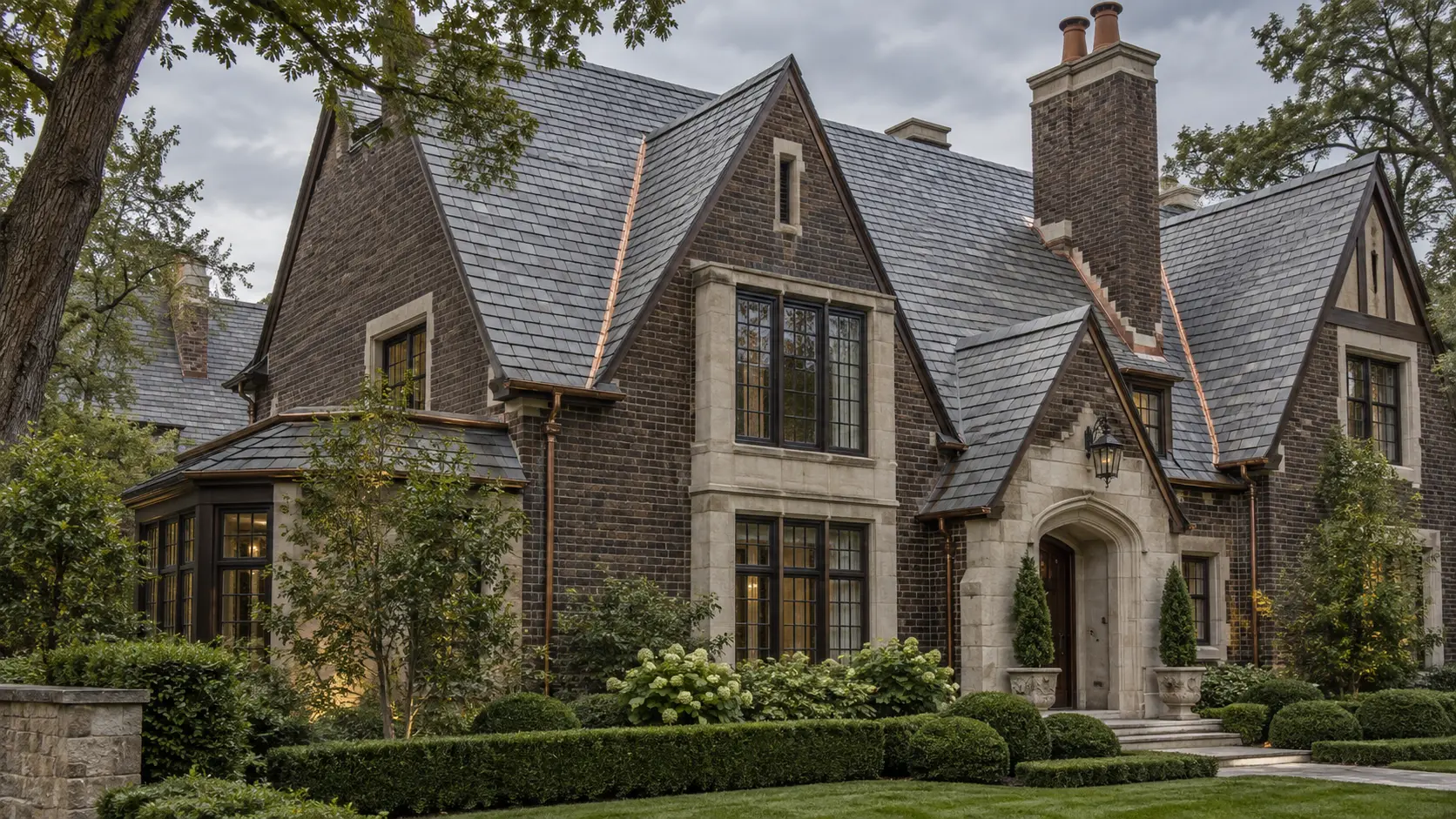 Tudor Revival home with a slate-style roof